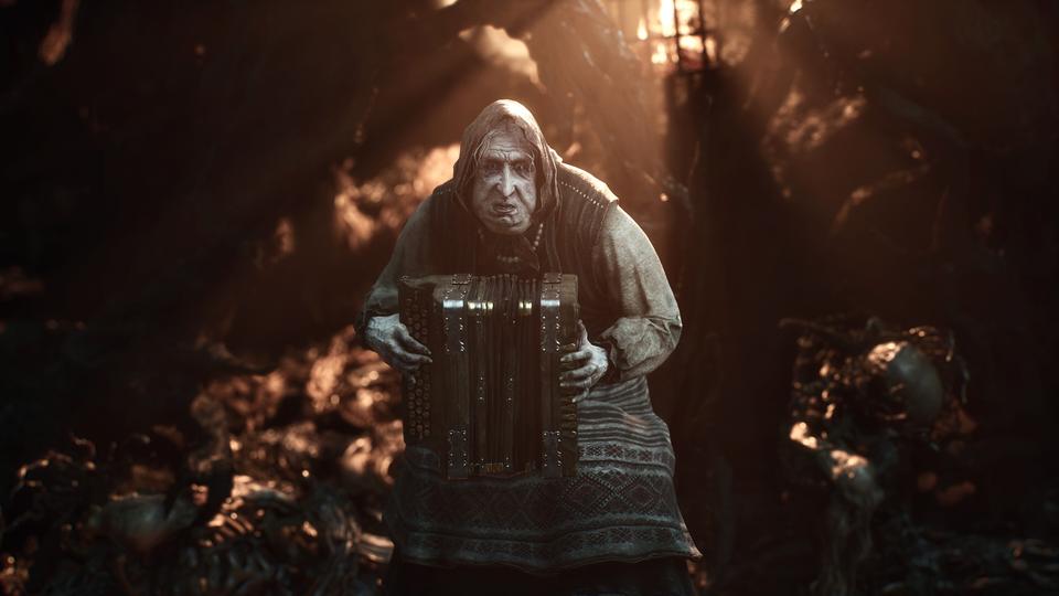 A hooded old woman grimly plays an accordion in a dark, bone-strewn ruin lit by amber light. — Mortal Shell II screenshot